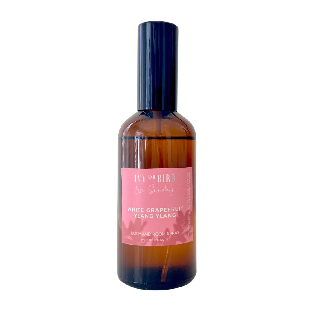 Grapefruit and ylang ylang luxury room spray on white background