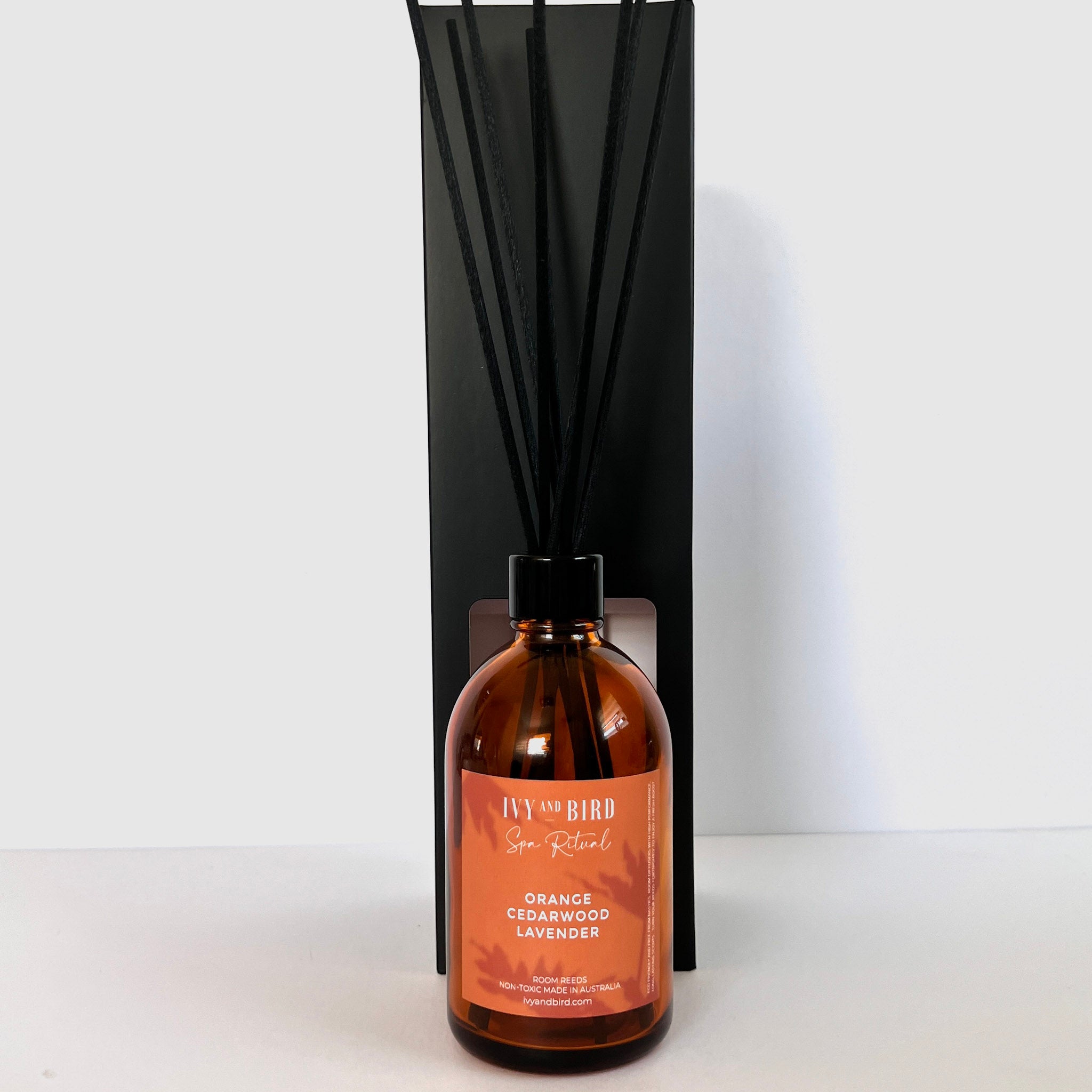 Australian Made essential oil reed diffuser in glass amber bottle with black fibre reeds