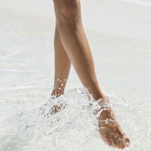feet kicking around in clear water