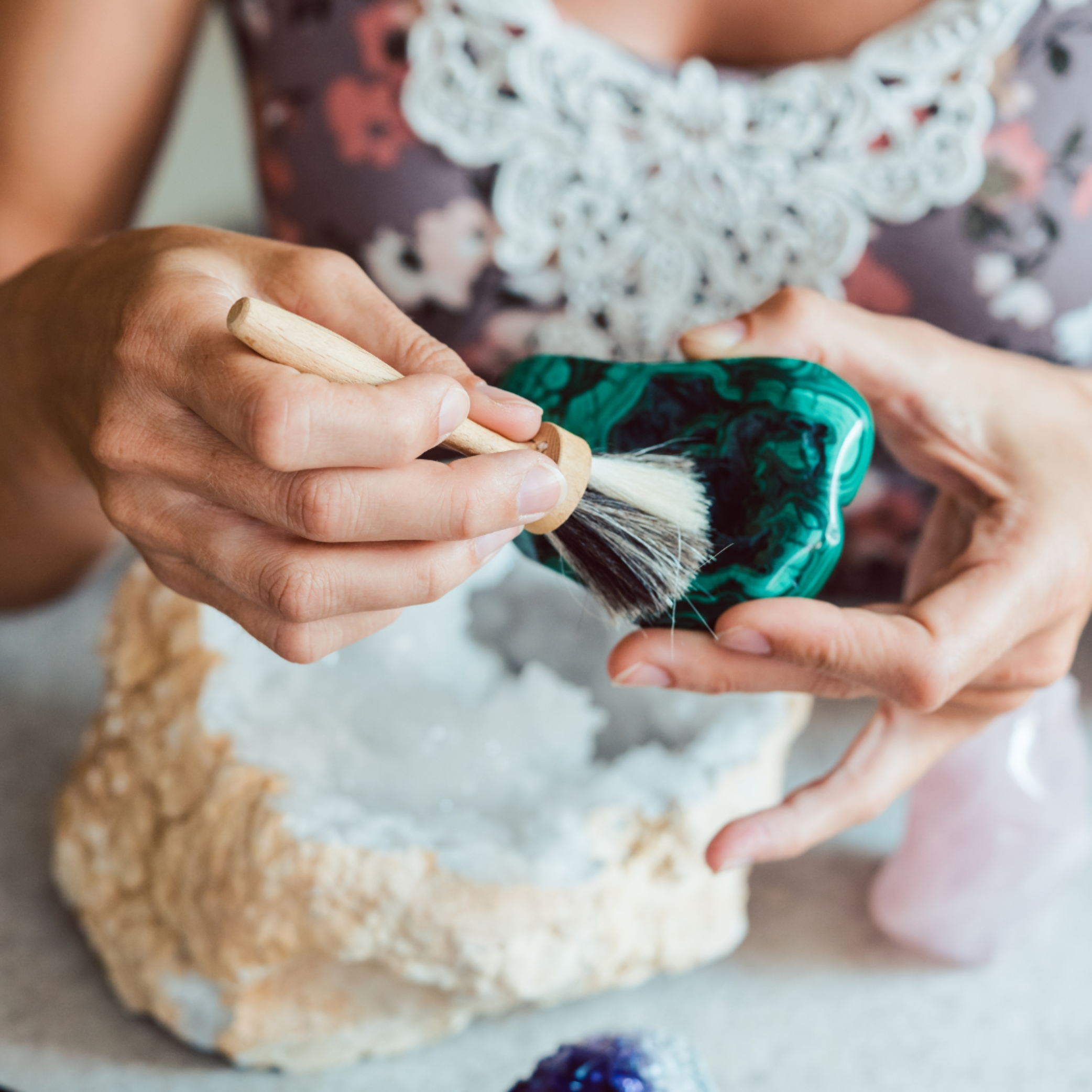 Malachite Gemstone with lady cleaning it