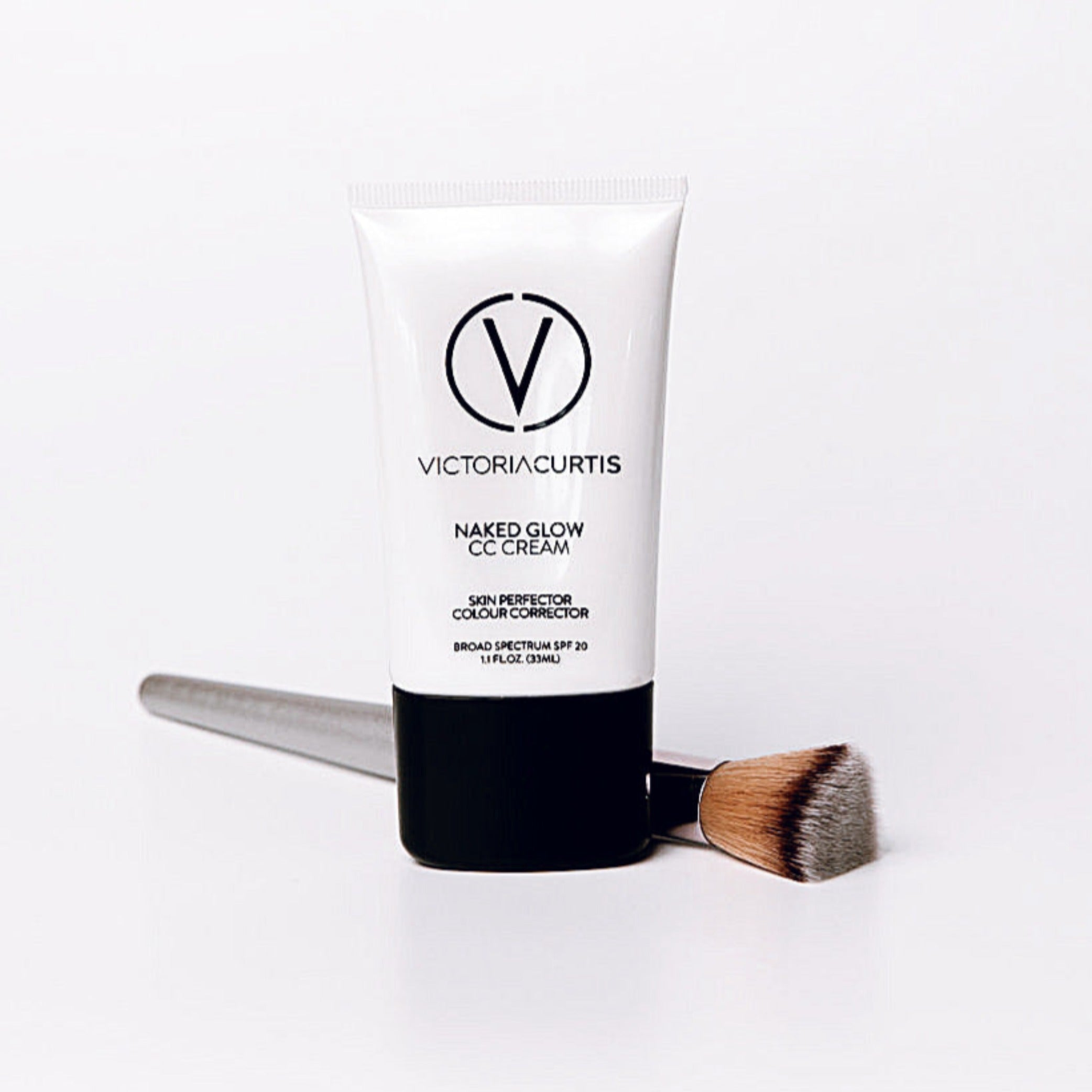 Naked glow CC Cream makeup by curtis collection in white tube with foundation brush