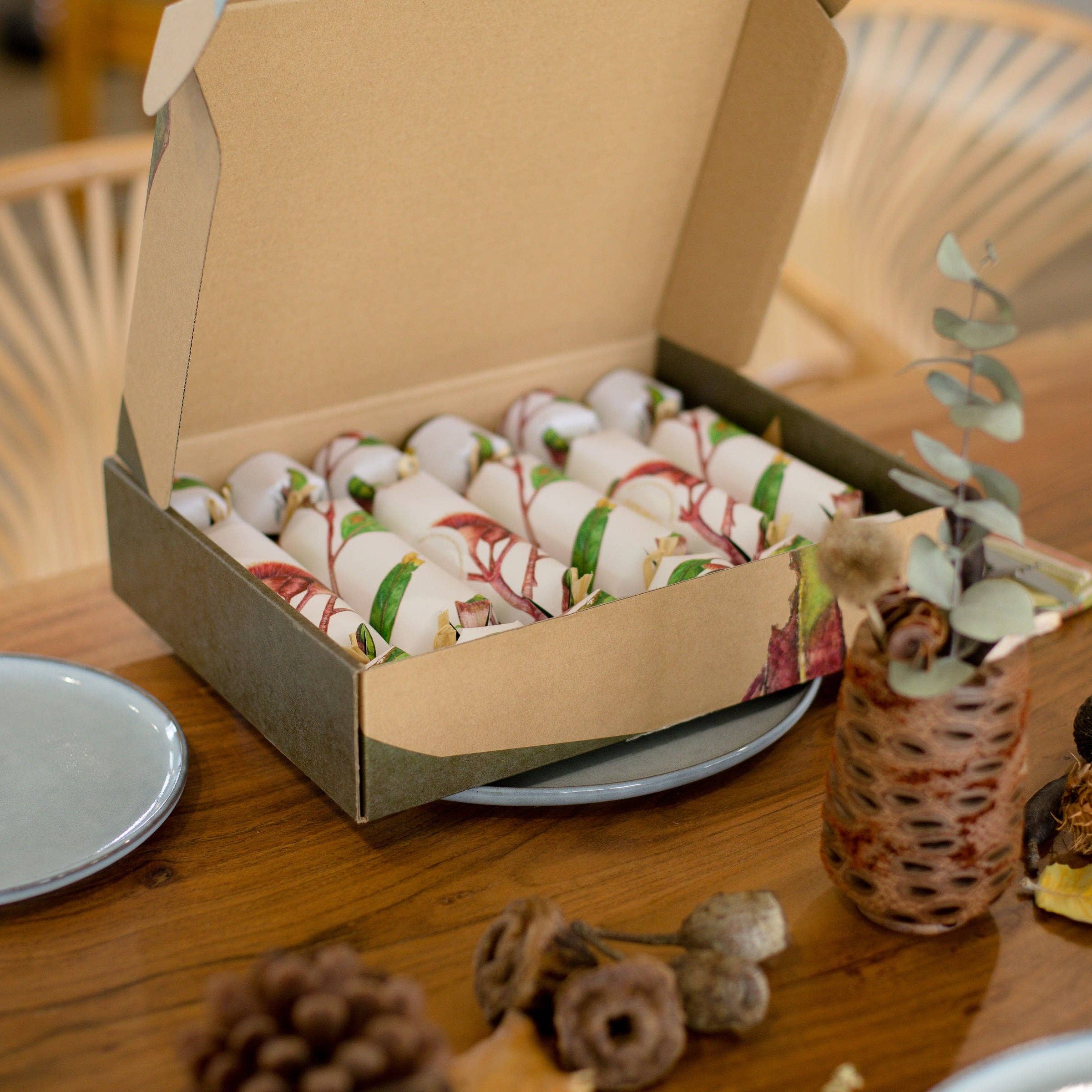 Open box of Christmas crackers on a wooden table